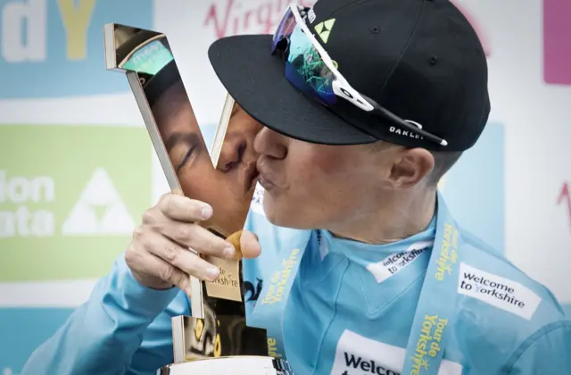 Serge Pauwels celebrates with the trophy after winning the Tour de Yorkshire