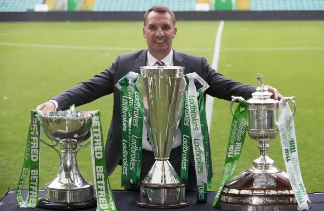 Brendan Rodgers with trophies