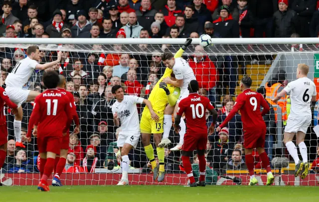 Tarkowski jumps with Alisson for opening Burnley goal