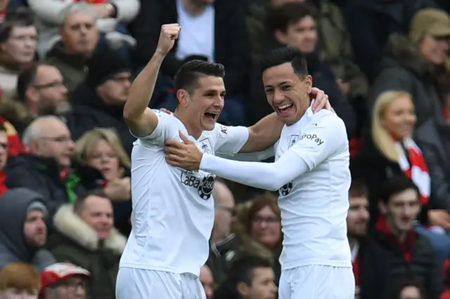 Dwight McNeil with goalscorer Ashley Westwood