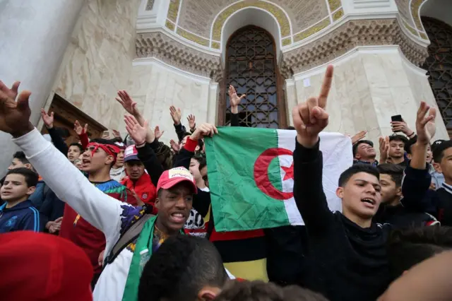 Algerian students demonstrate with national flags in the centre of the capital Algiers