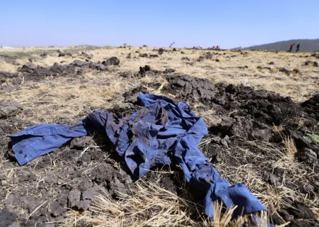 A shirt is seen at the scene of the Ethiopian Airlines Flight ET 302 plane crash, near the town of Bishoftu, southeast of Addis Ababa, Ethiopia March 11, 2019