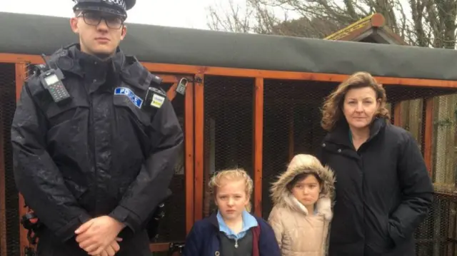 Children, policeman and teacher at Chicken Coop