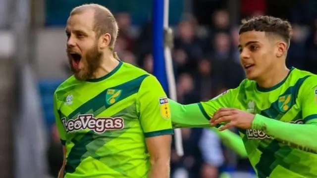 Norwich striker Teemu Pukki (left) celebrates scoring alongside Max Aarons