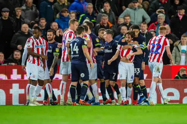 Derby and Stoke players come together...