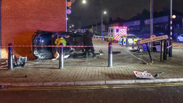 A car leaning against a wall