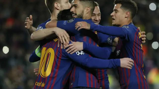 Barcelona players celebrate with Lionel Messi