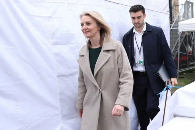 Chief Secretary to the Treasury Liz Truss walks through the temporary media centre set up opposite Parliament