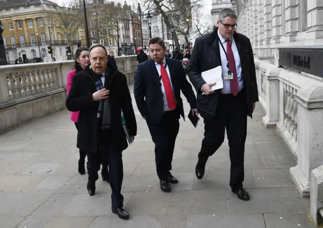 Deputy leader of the DUP Nigel Dodds (left) arrives in the Cabinet office