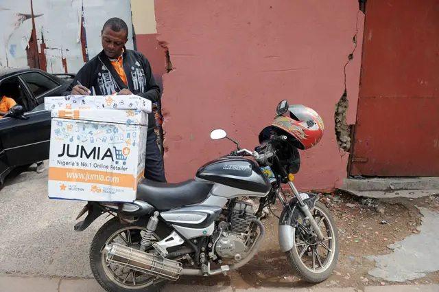 A Jumia scooterman records address of clients to be delivered with product at the Ikeja warehouse of the company in Lagos on June 12, 2013.