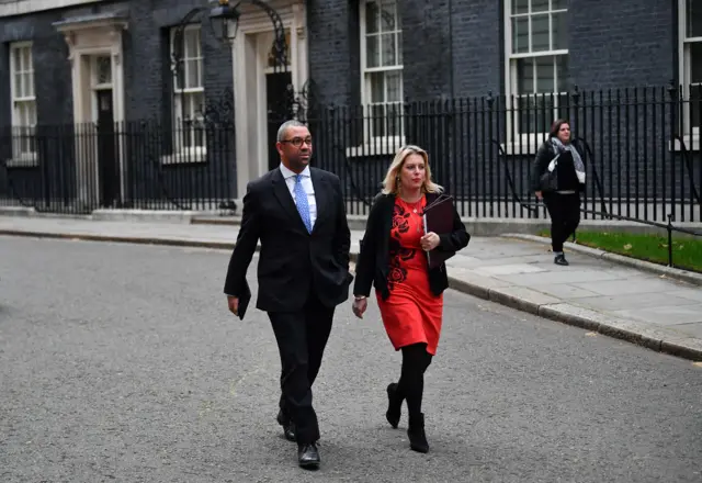 Conservative MP James Cleverly (left) leaves Downing Street