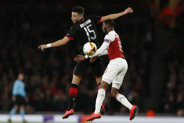 Ainsley Maitland-Niles challenges for the ball