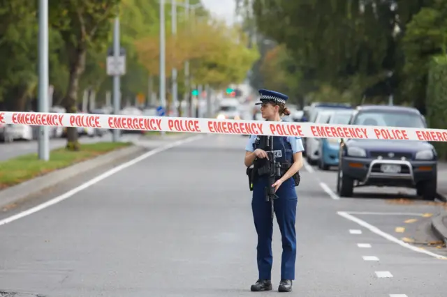 Police officers cordon off the area after gunmen attacked the two mosques and fired multiple times during Friday prayers in Christchurch