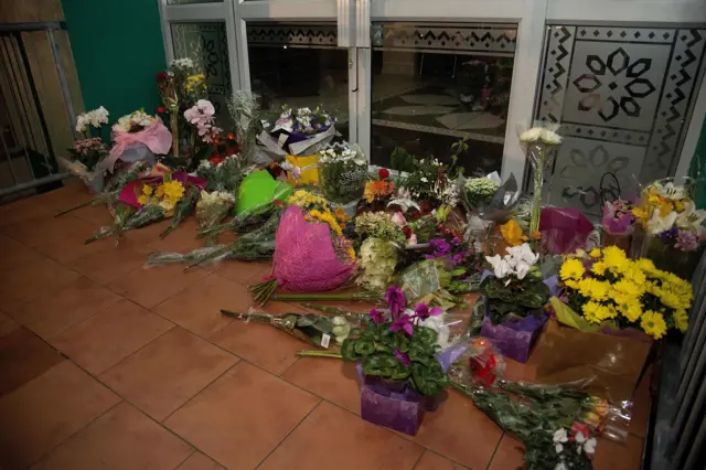 Flowers placed on the front steps of the Wellington Masjid mosque in Kilbirnie, Wellington