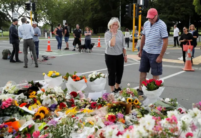 People place flowers outside the Al Noor mosque in Christchurch, New Zealand