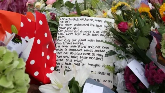 Messages left with floral tributes near the Al Noor mosque in Christchurch, New Zealand