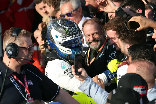 Bottas celebrates with his Mercedes team