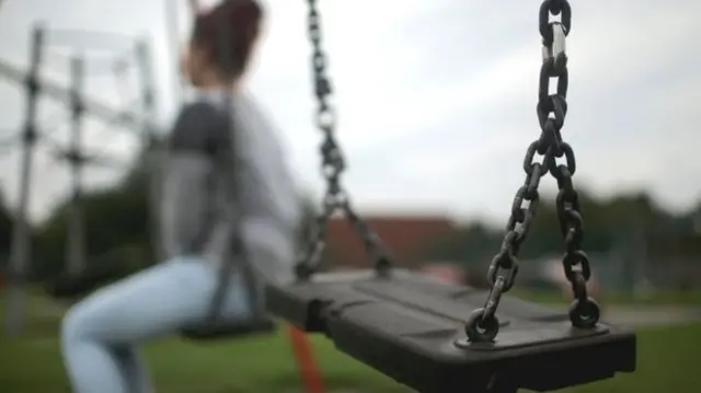 Child near swing