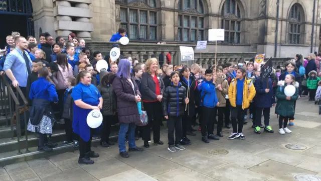 A group of children outside the Town Hall