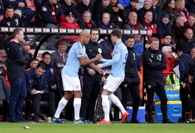 Kompany come on for Stones