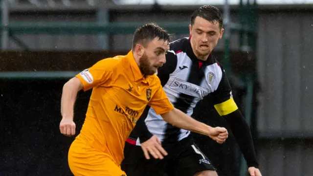 St Mirren captain Stephen McGinn keeps an eye on Stevie Lawless