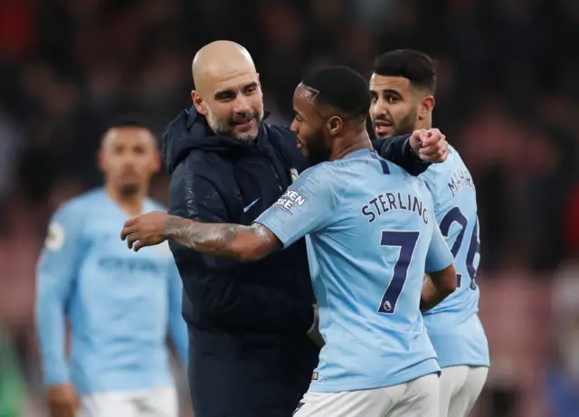 Guardiola and Sterling celebrate