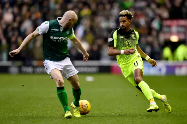 Hibernian captain David Gray keeps a close eye on Celtic winger Scott Sinclair