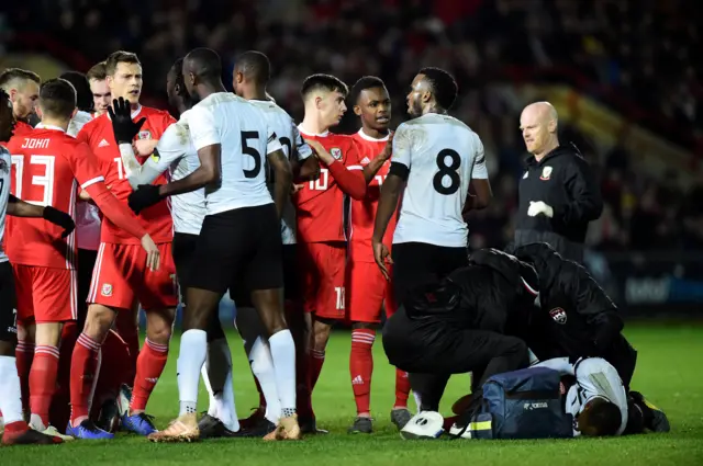 Wales' Lee Evans clashes with Trinidad and Tobago's Daneil Cyrus after fouling Leston Paul