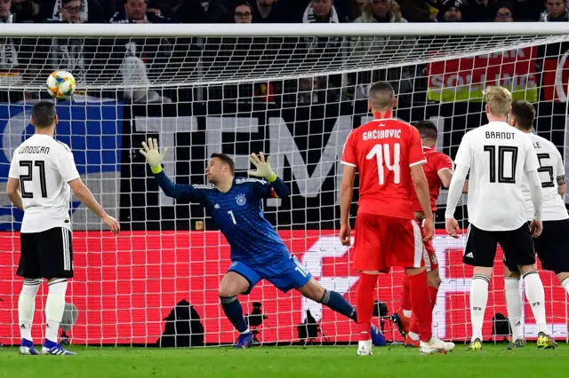 Germany's goalkeeper Manuel Neuer beaten by Jovic's header