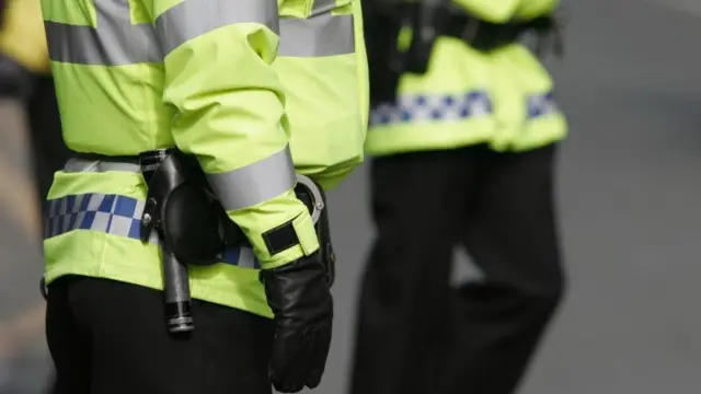 Close up of police in high visibility jackets