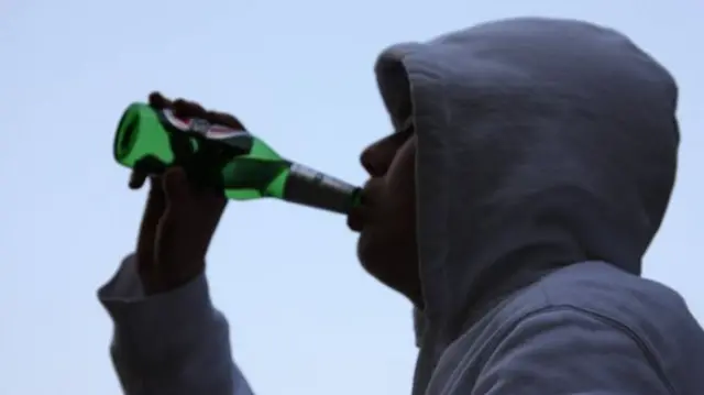 Young person drinking beer