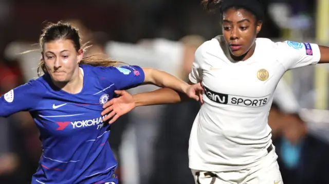 Hannah Blundell of Chelsea (left) tussles with PSG's Ashley Lawrence