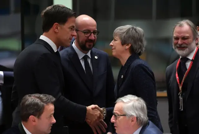 Netherlands Prime Minister Mark Rutte shakes hands with Britain"s Prime Minister Theresa May