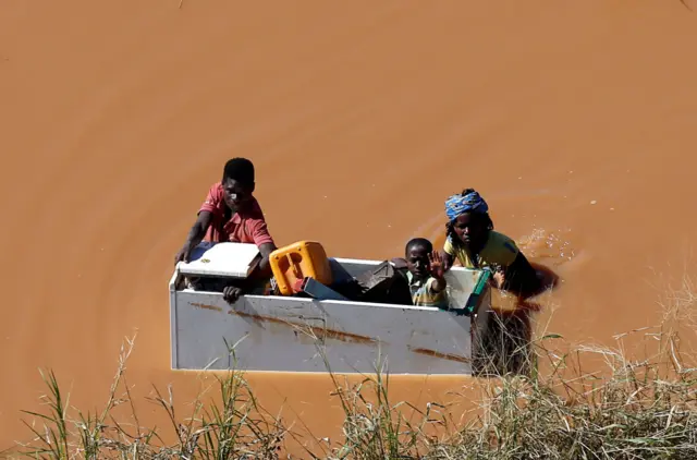 People in flood water