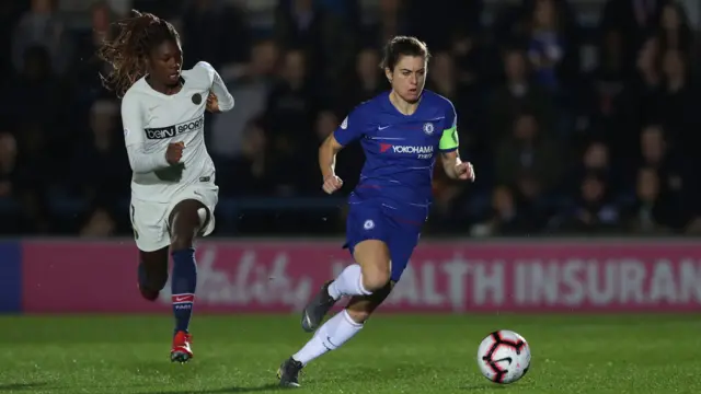 Karen Carney (right) surges forward