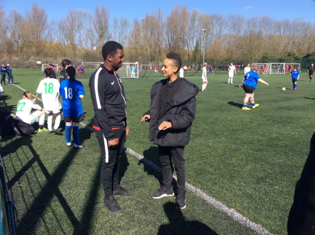 Adele Roberts speaks to St John's Ladies Deaf FC coach David