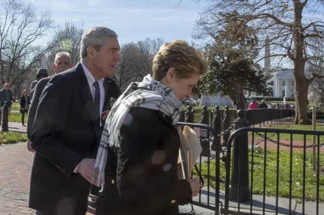 Mueller was pictured today with the White House behind him after he and his wife, Ann Mueller,