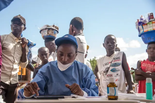 Nurses working with the World Health Organization (WHO) prepare to administer vaccines in the town of Mbandaka on May 21, 2018 during the launch of the Ebola vaccination campaign