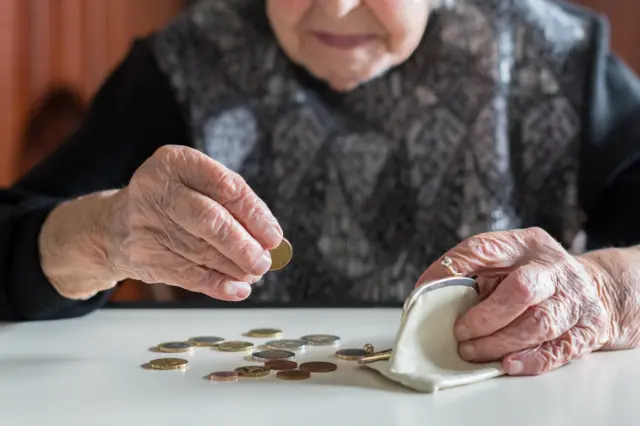 Woman counting coins