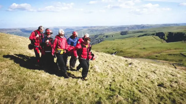 Casualty being stretchered to the air ambulance