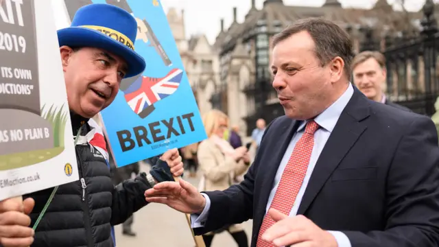 Businessman and co-founder of the Leave.EU campaign, Arron Banks (R) talks to anti-Brexit campaigner Steve Bray