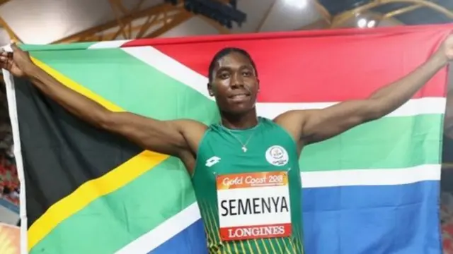 Caster Semenya with a South African flag