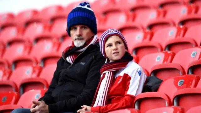 Two Stoke City fans at a recent game