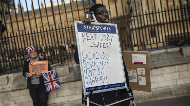 A Bookmaker displays the "odds" on the candidates for the next Prime Mininster outside the Houses of Parliament on March 28, 2019 in London, England. None of the eight proposals put to the vote in the House of Commons as an alternative to Theresa May"s Brexit Deal secured clear backing of Members of Parliament. MPs voted down each one in turn last night, leaving the Prime Minister"s deal as a possible way forward if the Speaker allows a third Meaningful Vote to be brought before the House.