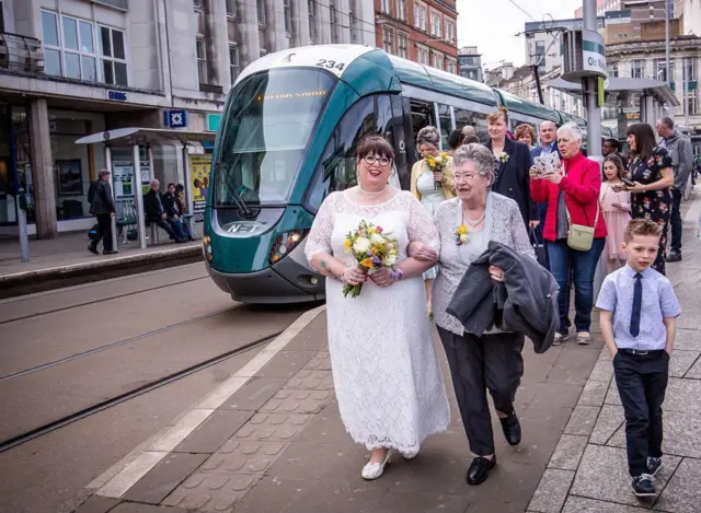 Toni Clay arrives to wedding by tram