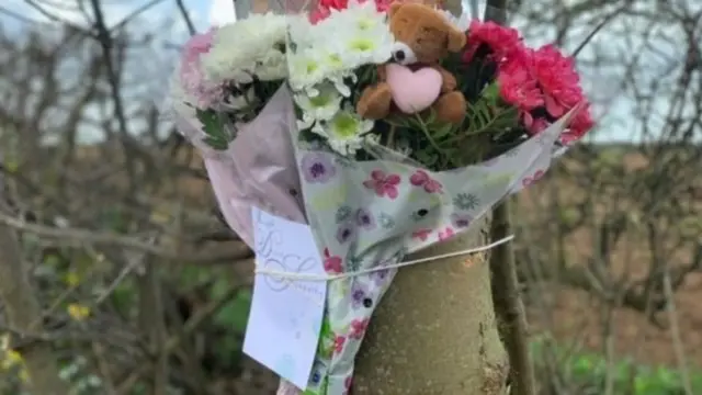 Flowers tied to tree