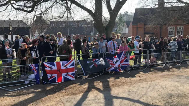 Fans gather along Keith Flint funeral procession route.