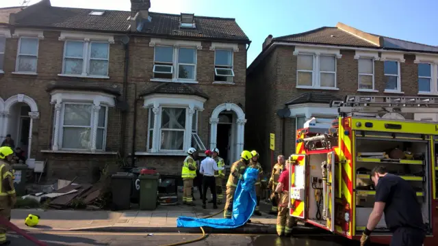 Firefighters outside house