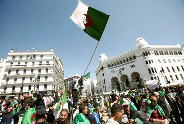 Protesters holding flag