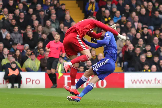 Ben Foster of Watford and Jamie Vardy of Leicester City clash